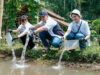 Penebaran Benih Ikan di Kolam pada Program Sosial Senyawa Employee Volunteer Volume 3 MIND ID di Desa Ciderum