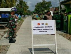 Antisipasi Penyebaran Covid, Babinsa Kampung Laut Bersama Satgas Kecamatan Bagikan Thermo Gun